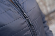 Load image into Gallery viewer, Close-up image of the durable zipper tab used to zip up or down on our Womens Lightweight Full Zip Black Puffy Jacket
